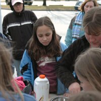 The scouts help with breakfast