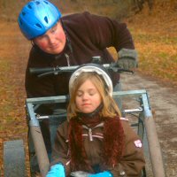 Girl scouts dryland dog sledding.